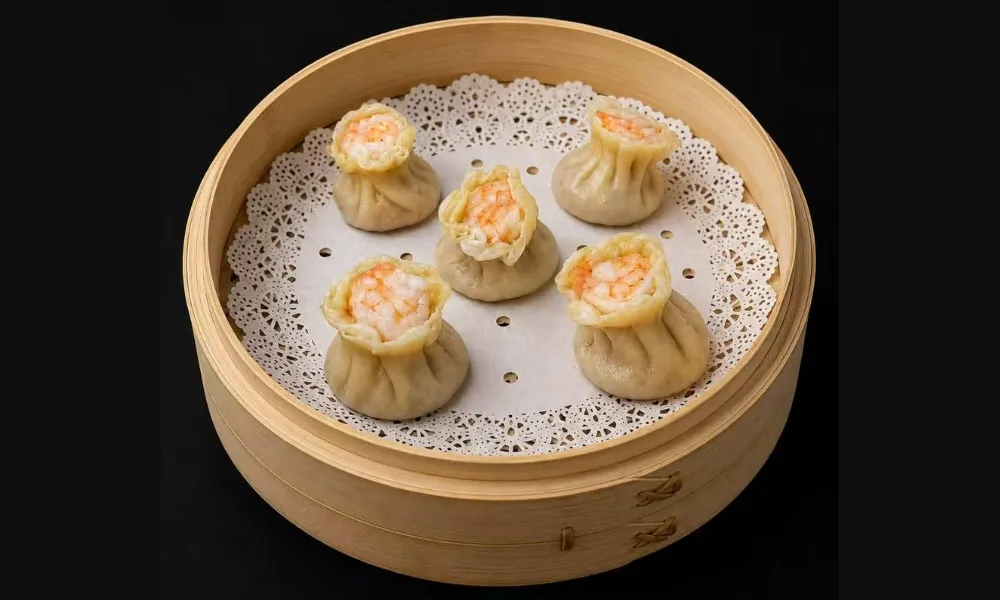 Shrimp siu mai served in bamboo steamer
